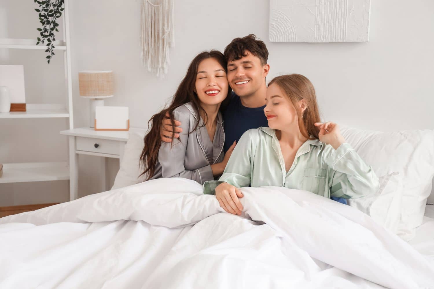 a group of people sitting in bed