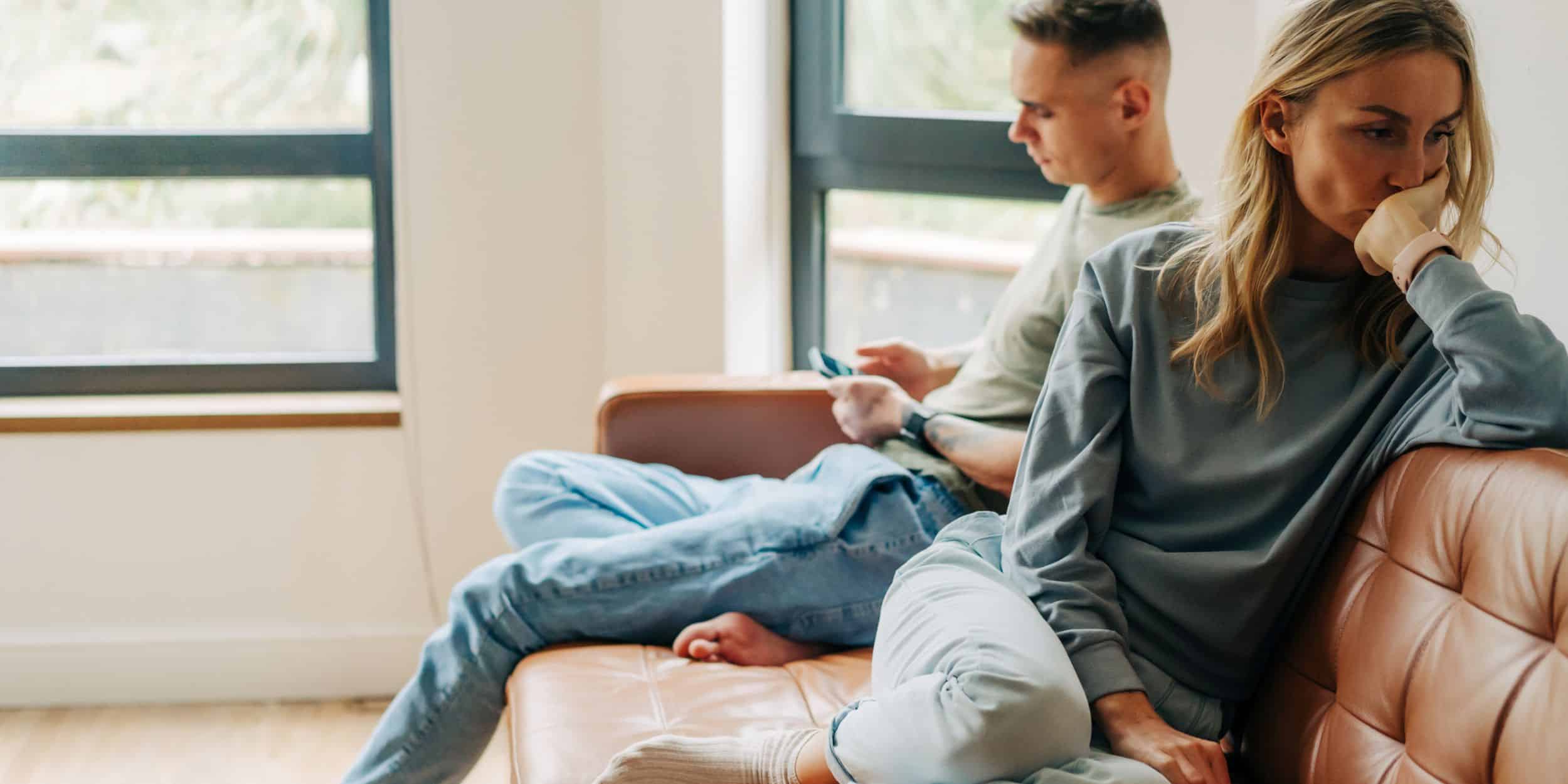 a man and woman sitting on a couch